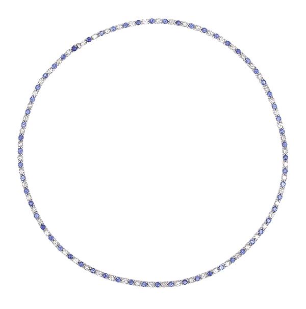 Appraisal: A SAPPHIRE AND DIAMOND RIVIERE NECKLACE Featuring sixty two sapphires