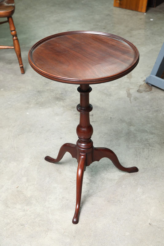 Appraisal: CANDLE STAND Walnut with a dish top turned pedestal and