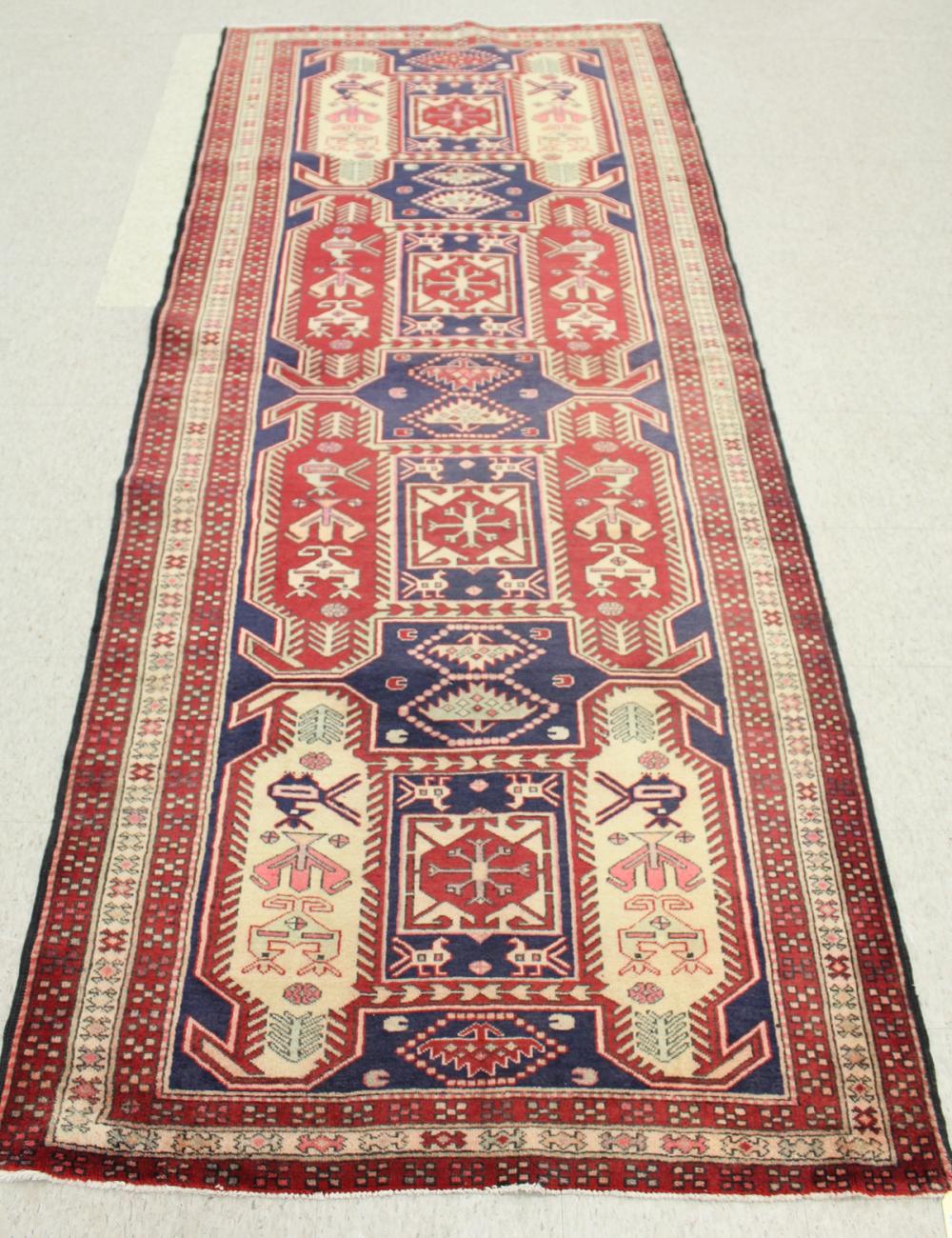 Appraisal: HAND KNOTTED PERSIAN TRIBAL RUG overall geometric design on dark