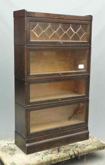 Appraisal: C 's four section oak stacking bookcase '' W '