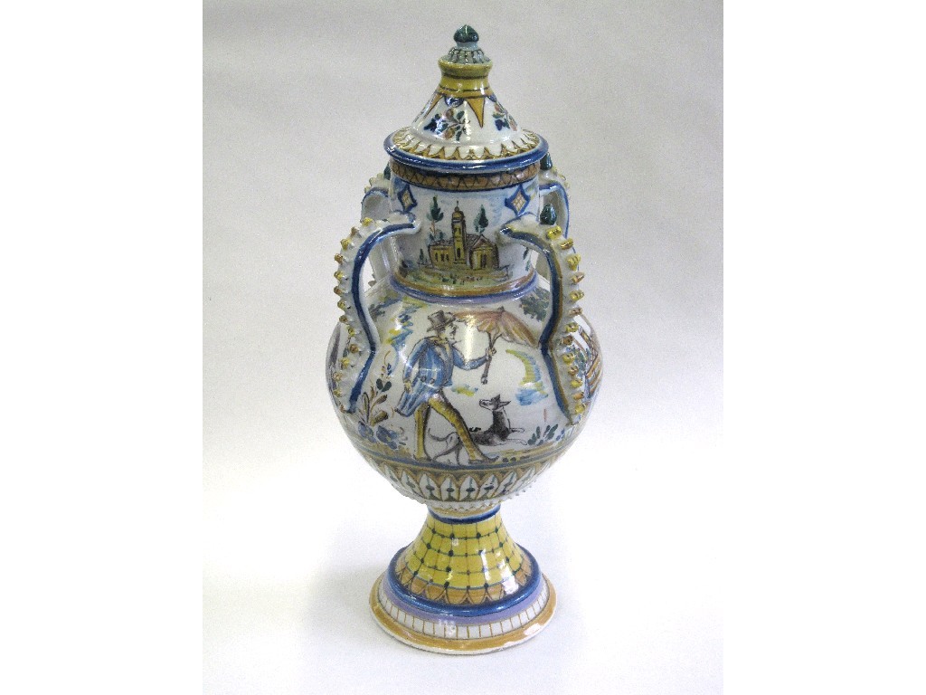 Appraisal: Italian tin glazed four handled jar and cover painted with