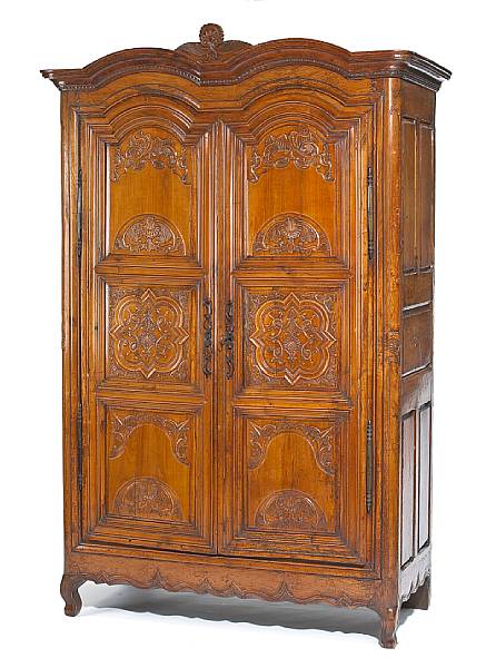 Appraisal: A fine R gence carved fruitwood armoire early th century