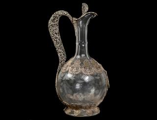 Appraisal: SILVER FILIGREE MOUNTED GLASS CLARET JUG Etched with flowers the