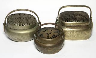 Appraisal: Three Chinese Brass Hand Warmers lot of Chinese brass hand