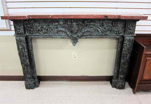 Appraisal: CAST BRONZE FIREPLACE SURROUND WITH ROSE MARBLE TOP Overall dimensions