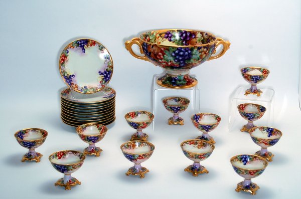 Appraisal: Dessert set comprised of twelve plates twelve footed bowls and