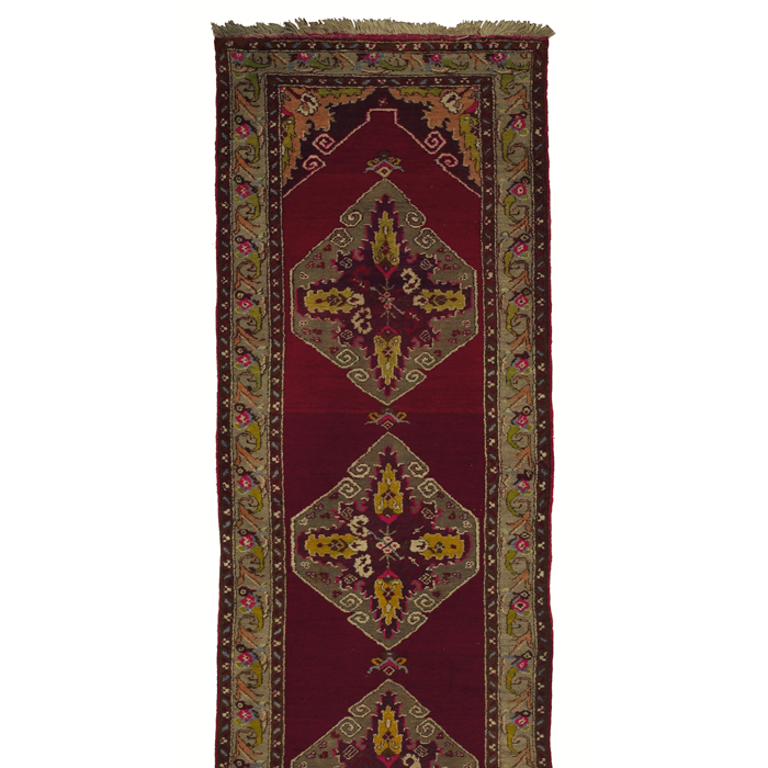 Appraisal: Turkish runner c floral design on a red field minor