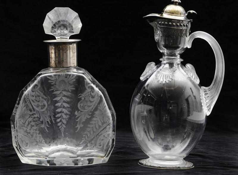 Appraisal: VICTORIAN SILVER-MOUNTED GLASS CLARET JUG AND A GERMAN SILVER-MOUNTED ENGRAVED