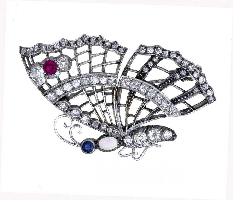 Appraisal: A RUBY DIAMOND SAPPHIRE AND OPAL BUTTERFLY BROOCH with colleted