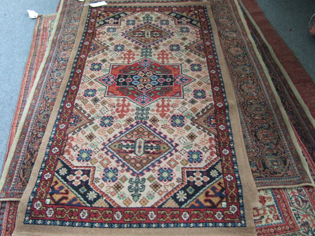 Appraisal: A Pakistan rug of Kazakh design the madder field with