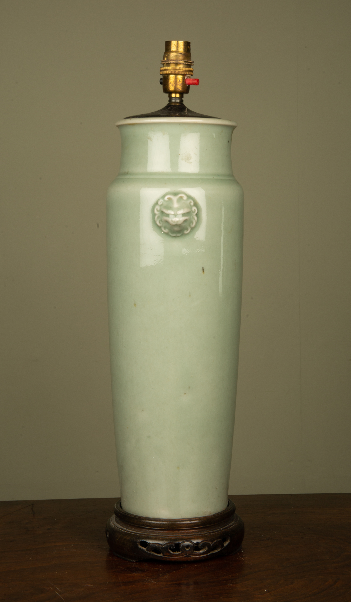 Appraisal: A celadon glazed table lamp of tapering cylindrical form decorated