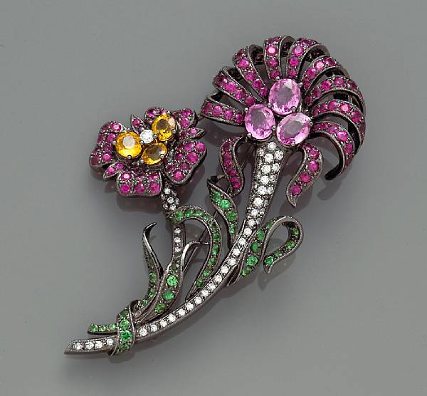 Appraisal: A diamond ruby and multi-colored sapphire brooch set throughout with