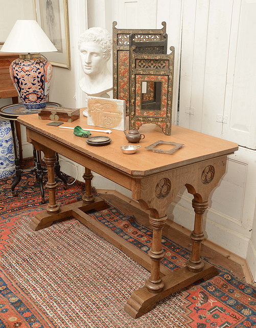 Appraisal: A VICTORIAN OAK GOTHIC REVIVAL TABLE with twin pilaster supports