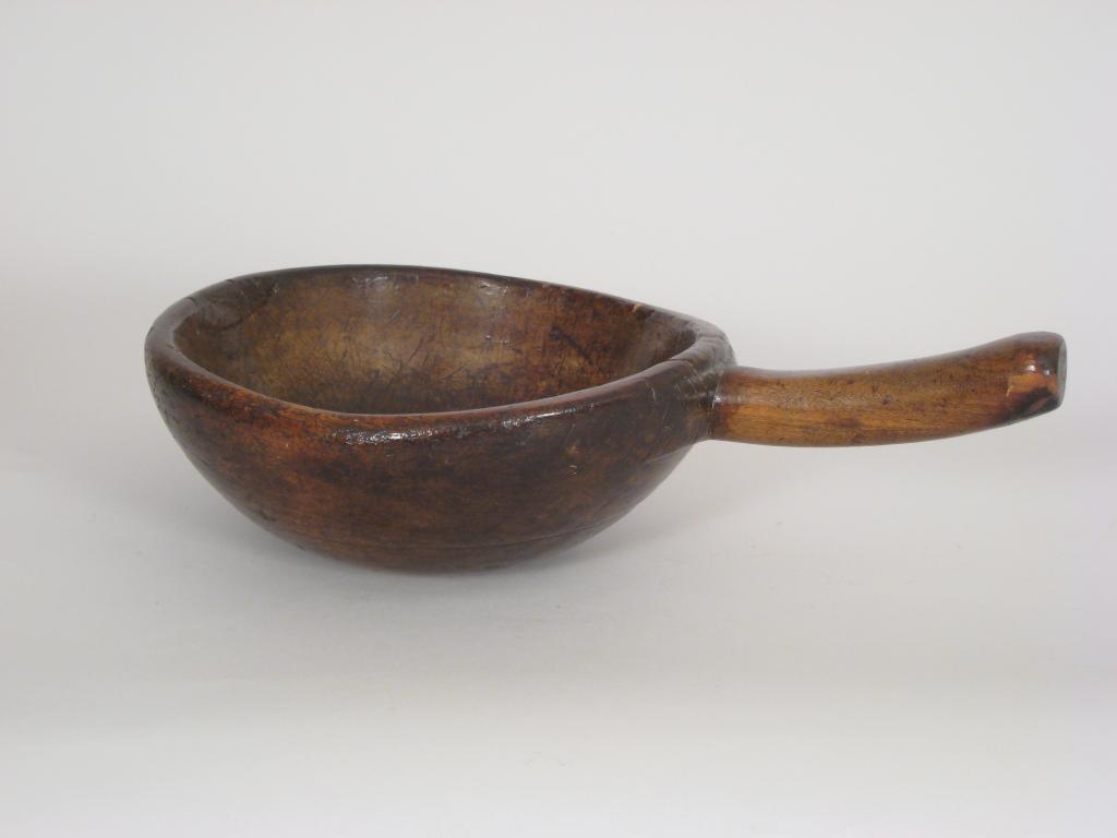 Appraisal: An antique treen Bowl of shaped circular form with integral