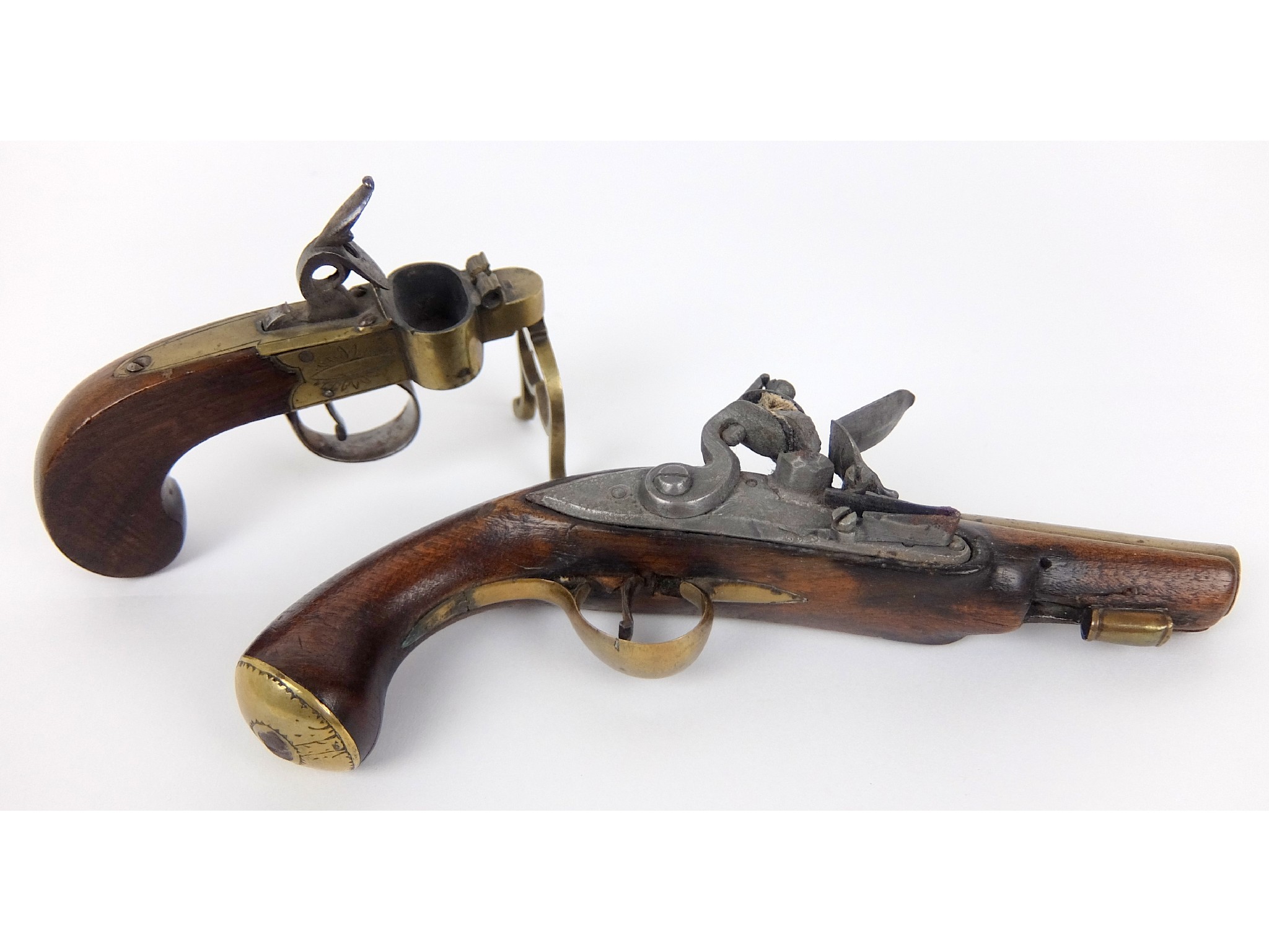 Appraisal: A flintlock pistol with brass barrel cm long trigger guard