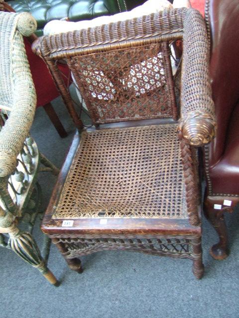 Appraisal: A wicker and split cane corner chair of Moorish design