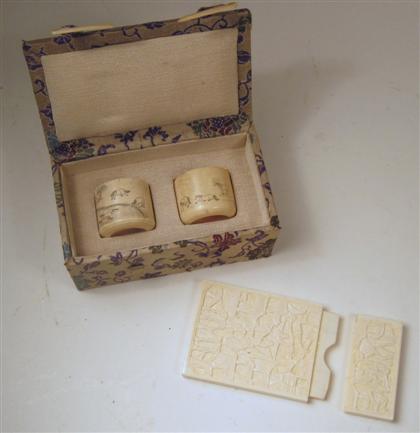 Appraisal: Pair of Chinese elephant ivory archers' rings and a card