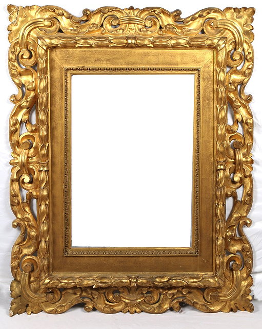 Appraisal: AN ANTIQUE FLORENTINE CARVED PIERCED AND GILDED FRAME with scrolling