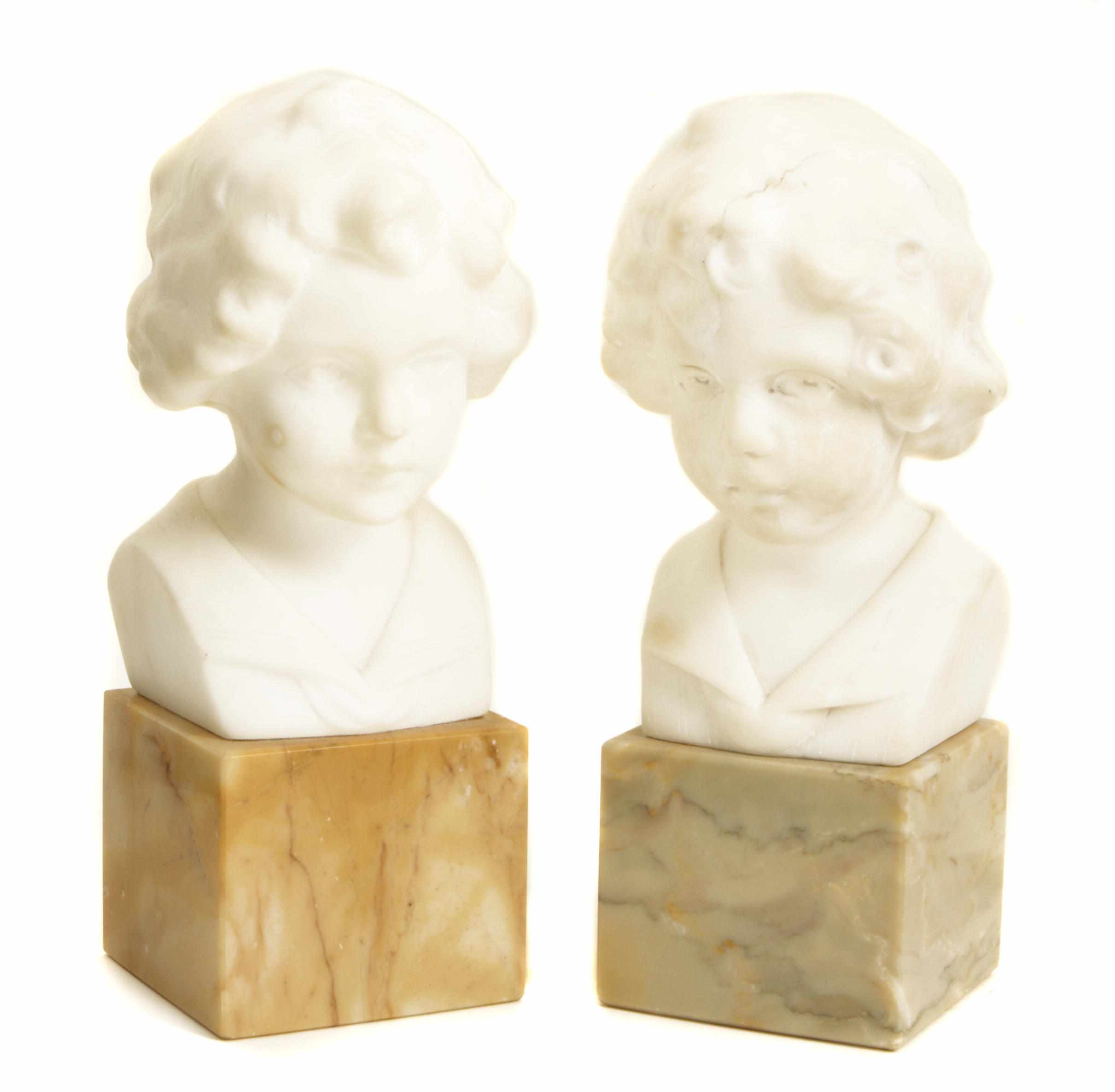 Appraisal: A pair of carved marble busts of youths Signed Greiner