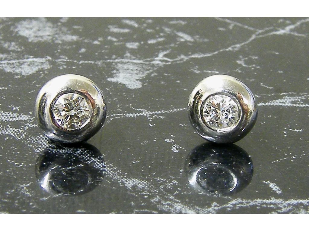 Appraisal: Pair of white gold diamond ear studs ct approx lacking