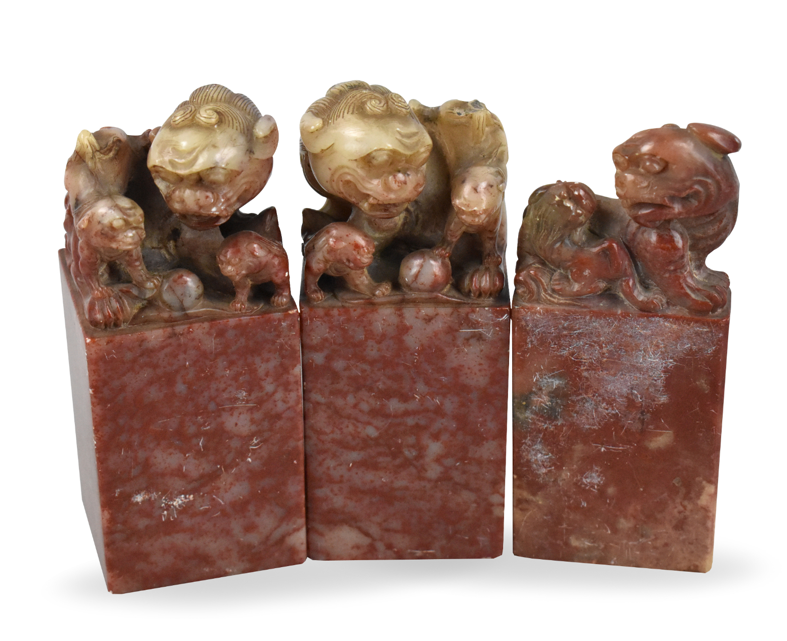 Appraisal: Three soapstone seals adorned with foo lions Two larger square