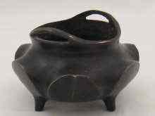 Appraisal: A Chinese cast bronze incense burner in the form of