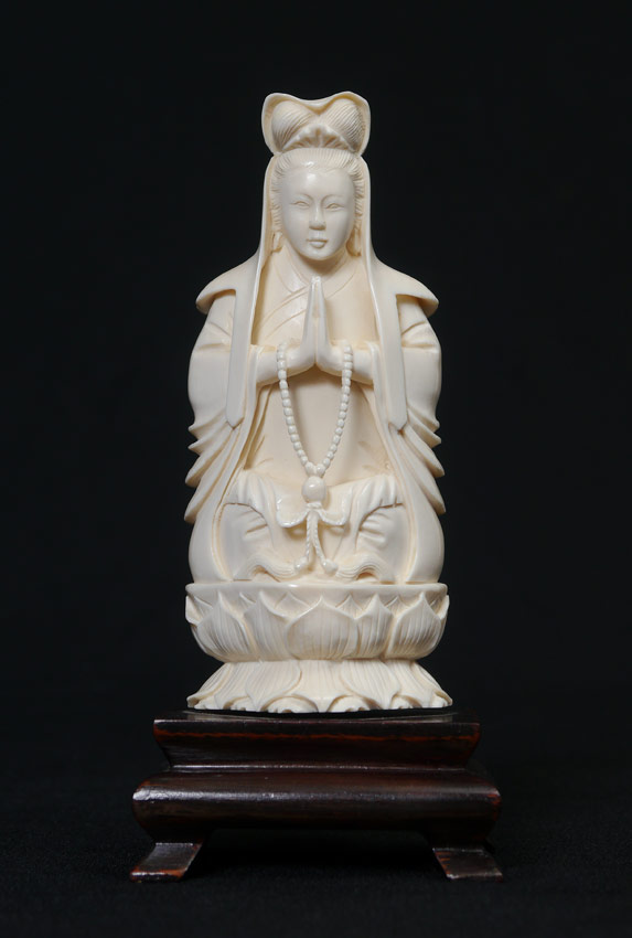 Appraisal: CHINESE CARVED IVORY FIGURE Figure of a seated woman praying