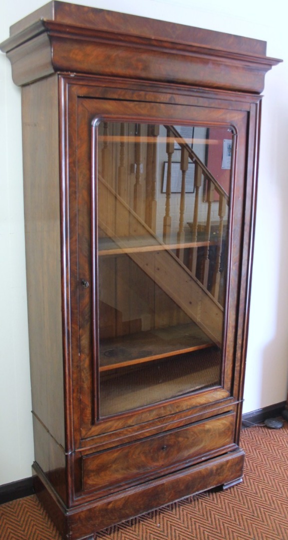 Appraisal: A thC flame mahogany display cabinet with an elaborate carved