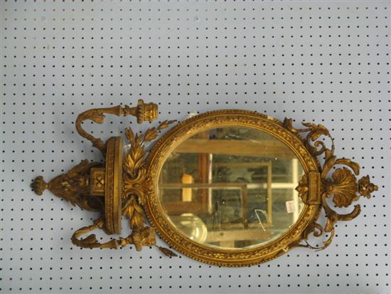 Appraisal: Gilt girandole with shell decoration to the top the oval