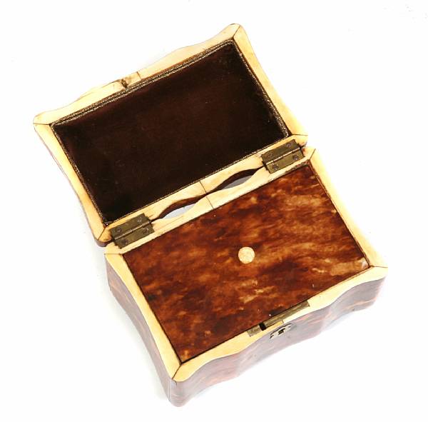 Appraisal: An English tortoise shell inlaid tea caddy height in width