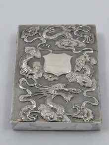 Appraisal: A Chinese silver card case the face finely embossed with