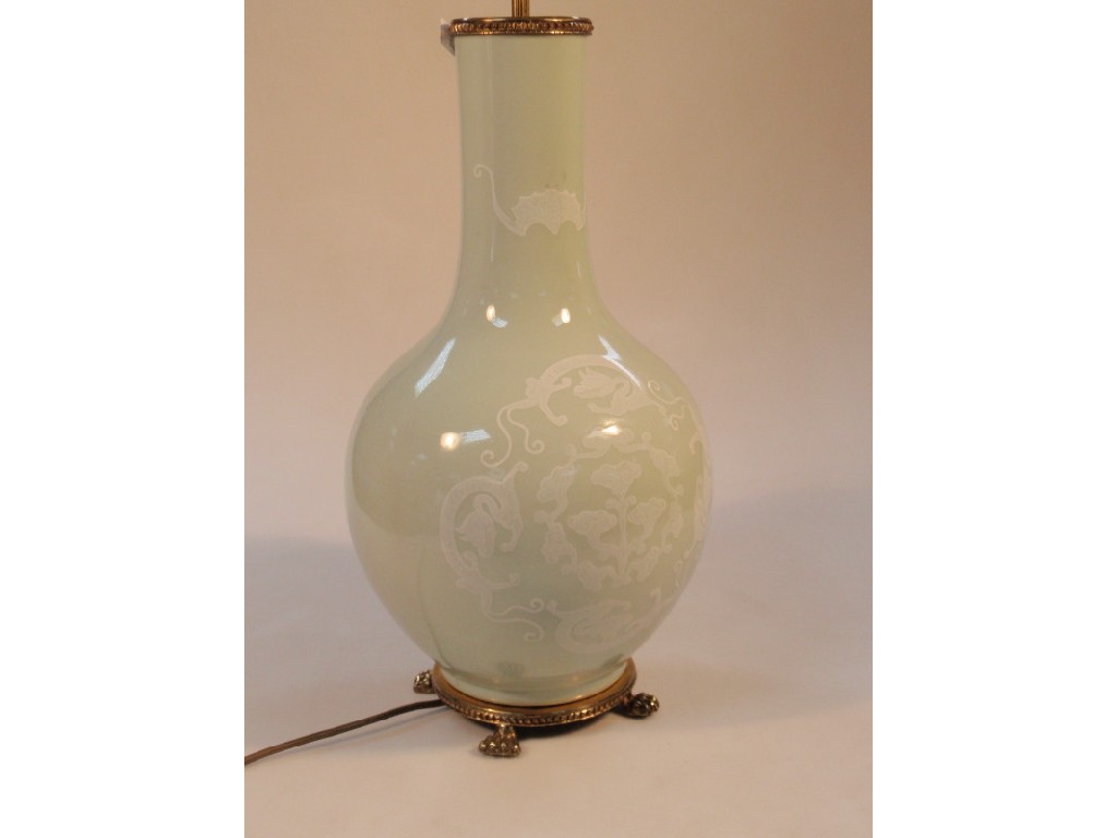 Appraisal: A Celadon pottery table lamp decorated with Chinese motifs in