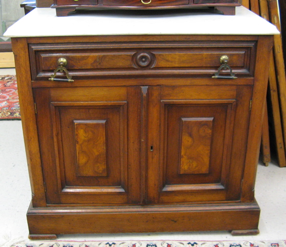 Appraisal: A VICTORIAN WALNUT COMMODE American c having a rectangular white