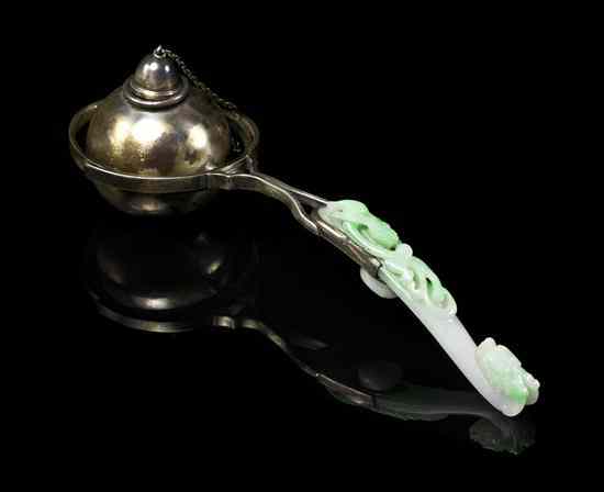 Appraisal: A Jadeite Belthook and Silver Mounted Cigar Lighter the hook