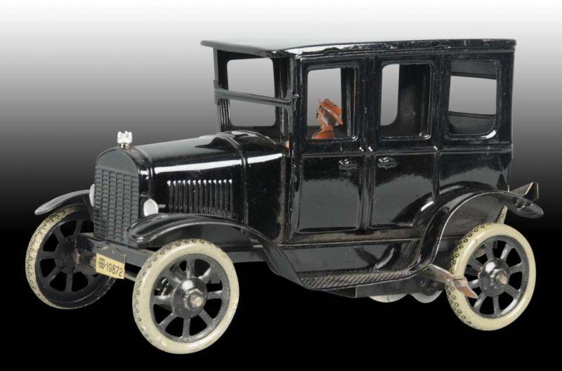 Appraisal: German Tin Wind-Up Bing Model T Sedan Toy Description Working