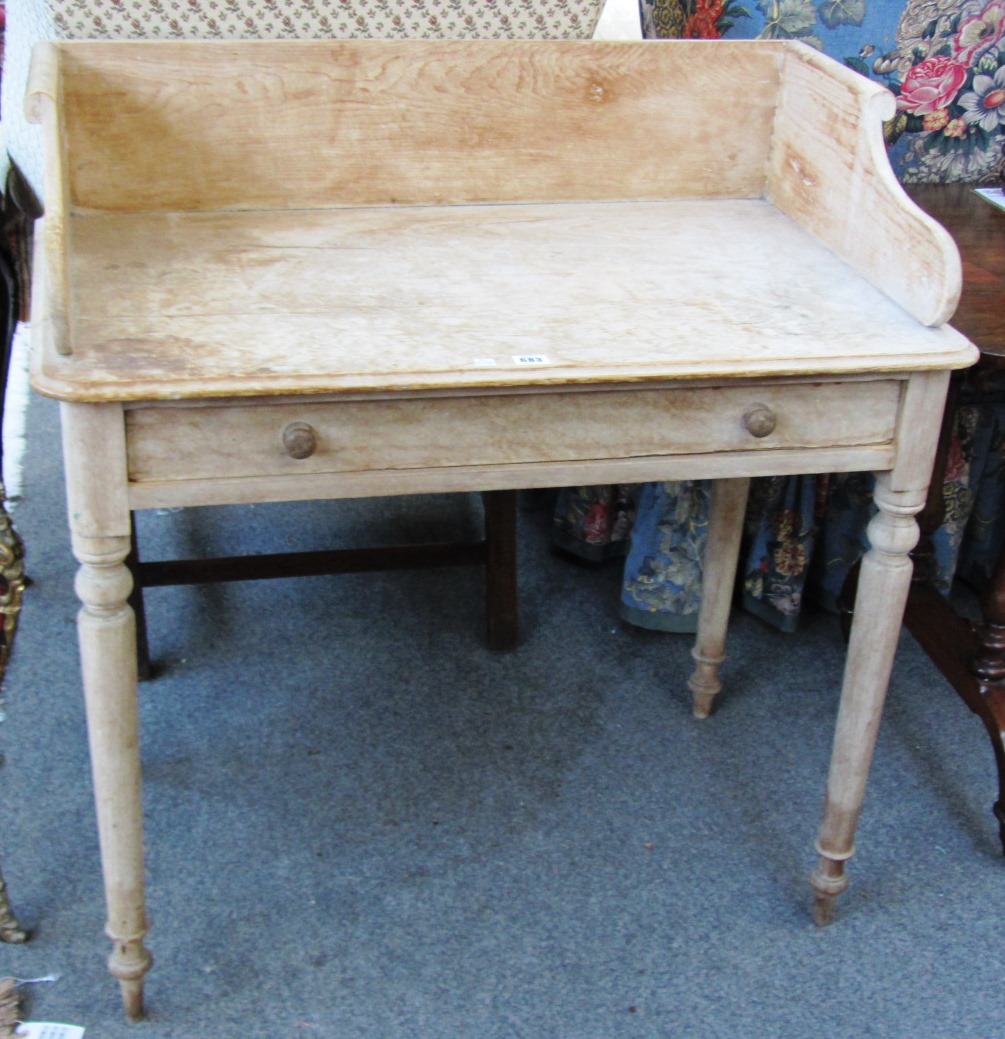 Appraisal: A Victorian pine and birch galleried back washstand with single