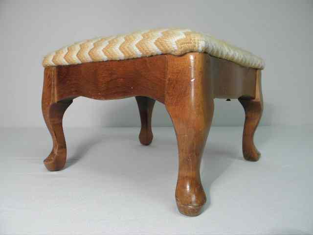 Appraisal: A small Walnut footstool with zig-zag pattered covering in colors