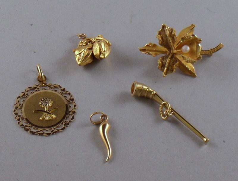 Appraisal: Four kt Gold Charms and an kt Gold Orchid Pin