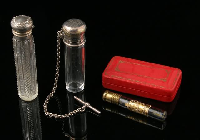 Appraisal: Including one signed Tiffany vest fob smelling salt snuffbottle with