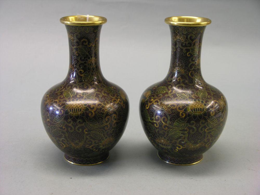 Appraisal: A pair of cloisonne vases bulbous shape with enamelled decoration