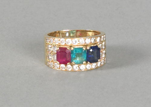 Appraisal: K yellow gold mother's ring with triangular cut ruby emerald