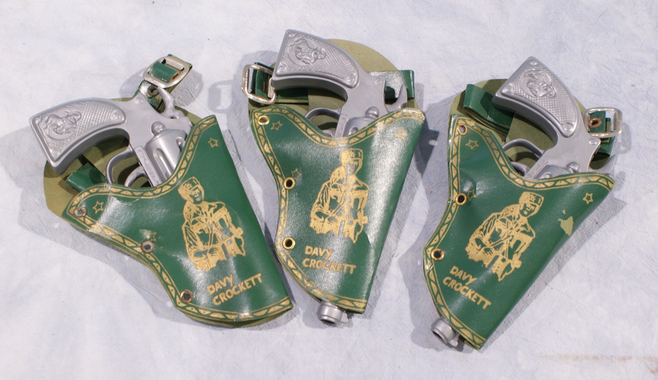 Appraisal: Davy Crockett gray plastic guns in green holsters