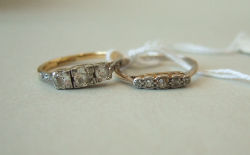 Appraisal: A gold and platinum diamond set three stone ring mounted