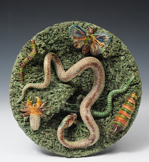 Appraisal: A PORTUGUESE PALISSY STYLE CHARGER the moss ground applied with