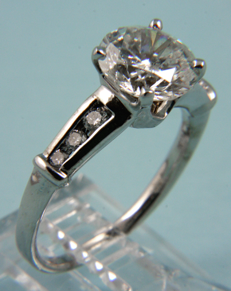 Appraisal: Platinum and diamond ring ct center diamond flanked by three