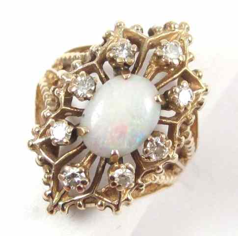 Appraisal: OPAL DIAMOND AND TEN KARAT GOLD RING eight round-cut diamonds