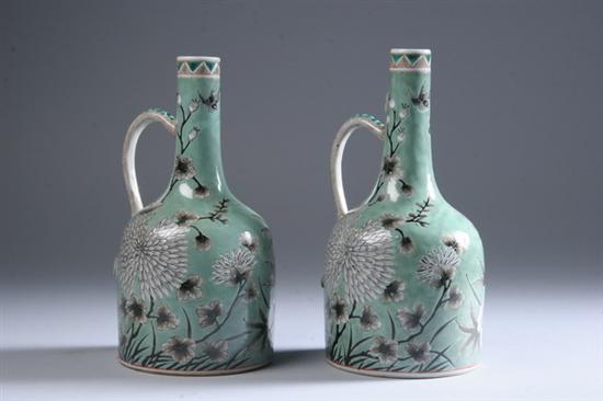 Appraisal: PAIR CHINESE GRISAILLE AND GREEN PORCELAIN EWERS th century Floral