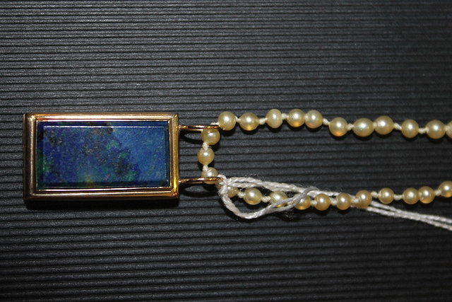 Appraisal: A CT GOLD LOCKET of rectangular form with blue enamel