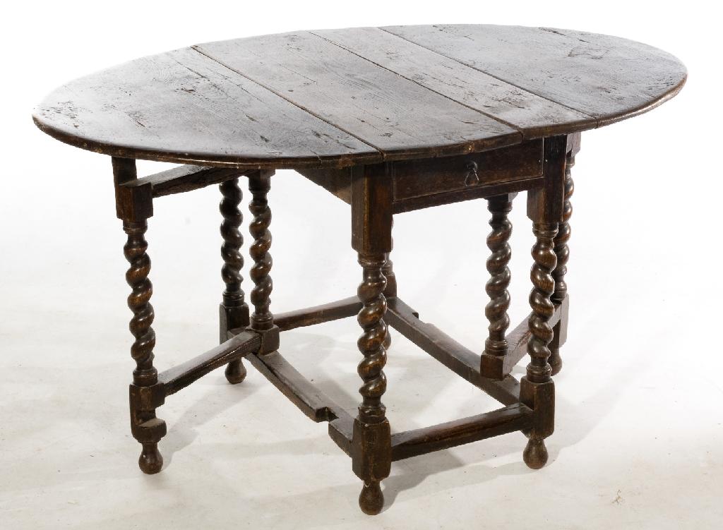 Appraisal: LATE th CENTURY OAK GATELEG DINING TABLE the oval top