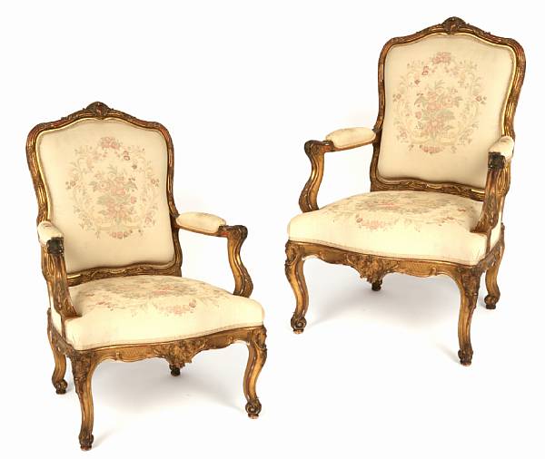 Appraisal: A pair of Louis XV style carved giltwood fauteuils late